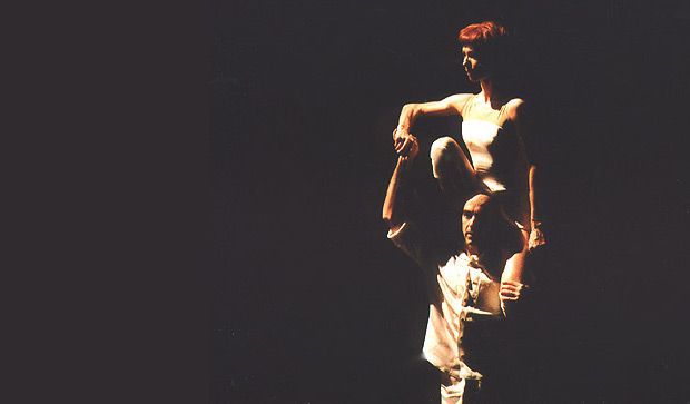 Sylvie Guillem and Russell Maliphant in <I>Push</I>, taken in 2005. From a John Ross <a href="http://www.ballet.co.uk/gallery/jr_guillem_maliphant_push_0905">Gallery of 6 images</a>.<br />© <a href="http://www.johnrossballetgallery.co.uk">John Ross</a>.