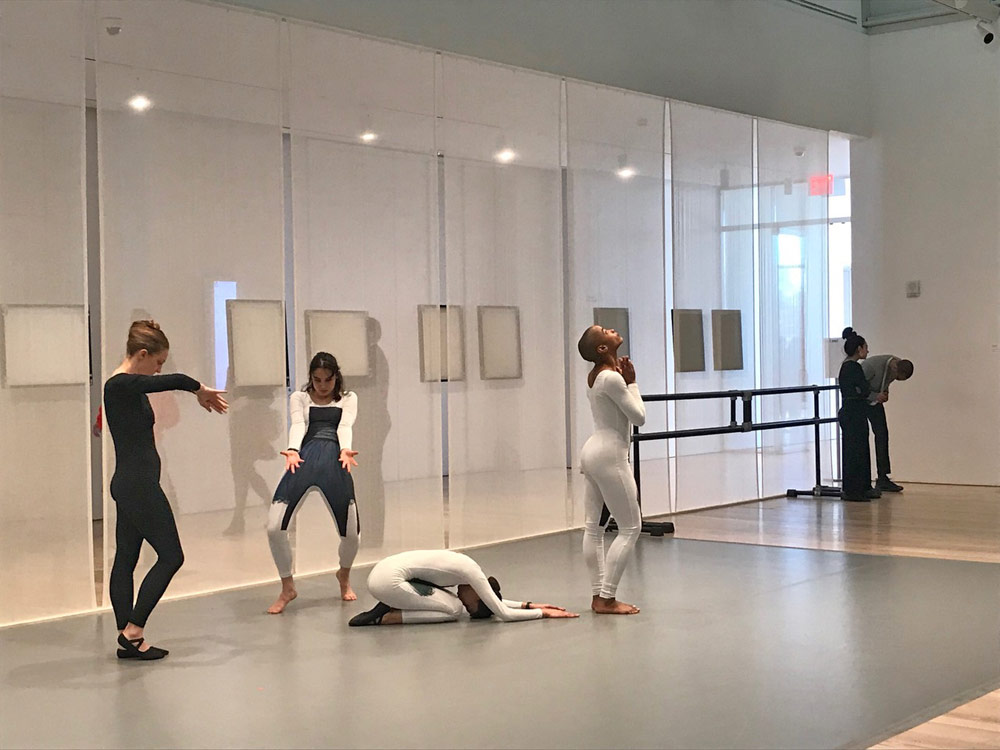 Alex Jacob, Maggie Cloud, Anna Witenberg and Jasmine Hearn, dancing at the exhibit.<br />photo © Marina Harss. (Click image for larger version)