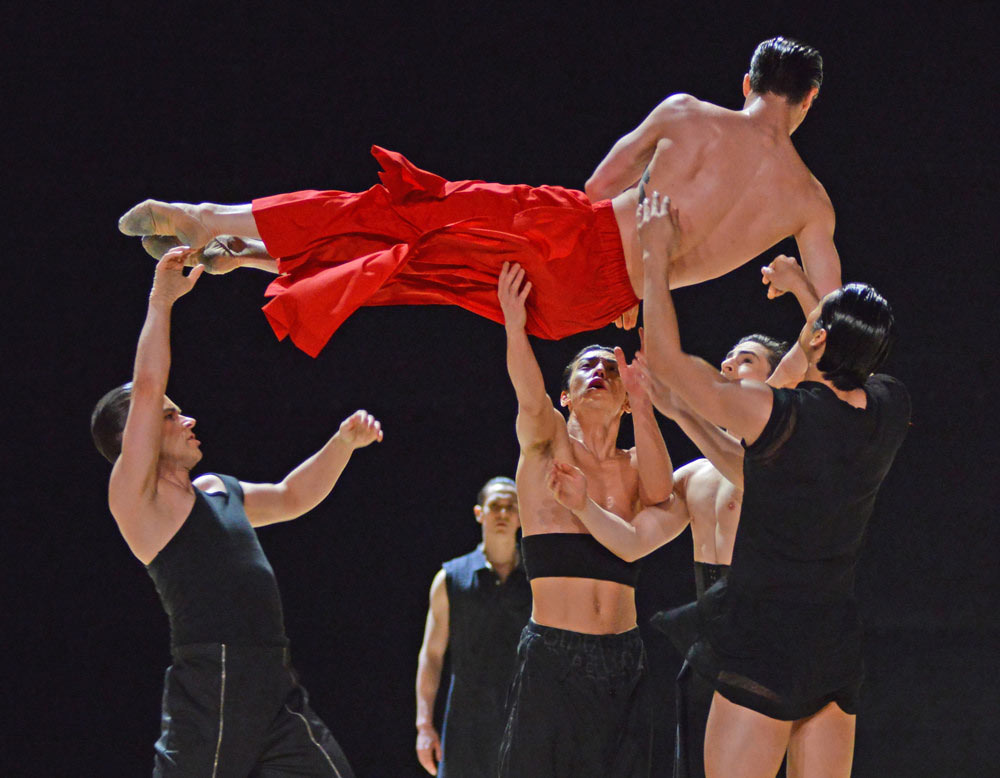 Calvin Richardson (thrown by Alexander Campbell, Luca Acri, Tristan Dyer and Ryoichi Hirano) in Obsidian Tear. © Dave Morgan, courtesy the Royal Opera House. (Click image for larger version)